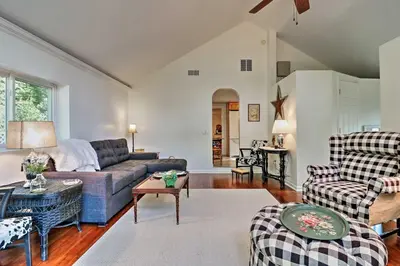 a living room with a couch and a table at Ottawa Lake Home with BBQ and Patio, 15 Mi to Toledo in Sylvania