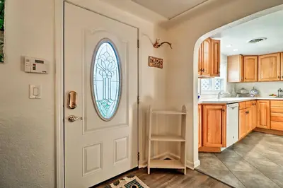 a kitchen with a white door with a window at Ottawa Lake Home with BBQ and Patio, 15 Mi to Toledo in Sylvania