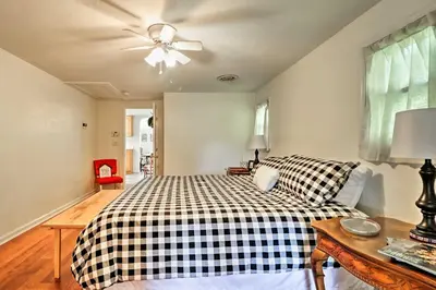 a bedroom with a bed and a ceiling fan at Ottawa Lake Home with BBQ and Patio, 15 Mi to Toledo in Sylvania
