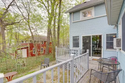 a porch with chairs and a table on a house at Spacious Lakeside Cottage - 2 Miles to Marblehead! in Lakeside