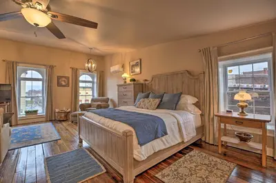 a bedroom with a bed and a ceiling fan at Chic Main Street Retreat Less Than 7 Mi to KY Horse Park! in Georgetown