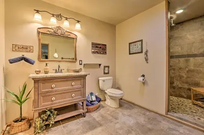 a bathroom with a sink and a toilet and a shower at Butler Cabin on 19 Acres with Hot Tub and Fire Pit! in Butler