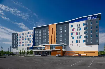a hotel with a parking lot in front of it at Aloft Columbus in Columbus
