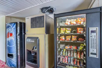 a refrigerator filled with lots of drinks and soda at Econo Lodge Huntington - Barboursville University Area in Huntington