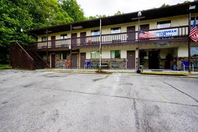 an empty parking lot in front of a building at OYO Hotel Chapmanville Inn, WV - Hwy 119 in Chapmanville