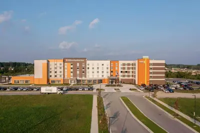 a large building with a parking lot in front of it at Home2 Suites By Hilton Fort Wayne North in Sunnybrook Acres