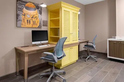 an office with a desk with a computer and two chairs at Home2 Suites By Hilton Fort Wayne North in Sunnybrook Acres