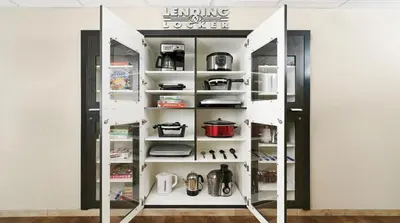 a room with a door open to a pantry at Candlewood Suites - Cleveland South - Independence by IHG in Independence