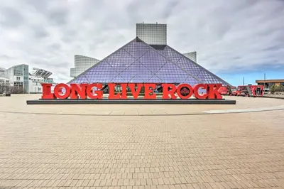 a large building with a sign that reads long live rock at Dtwn Cleveland Loft-Style Condo Walk to Stadiums! in Cleveland