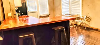 a kitchen with a wooden counter top in a room at Hocking Hills Rusty Lofts in Logan