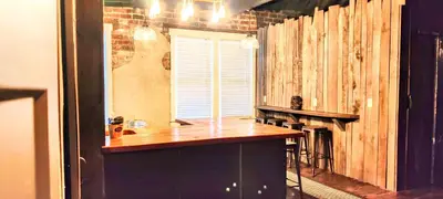 a kitchen with a counter top and a fireplace at Hocking Hills Rusty Lofts in Logan