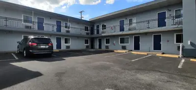 a van parked in a parking lot in front of a building at Cedar Cove in Sandusky