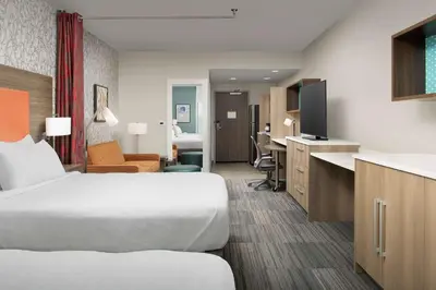 a hotel room with a bed and a desk at Home2 Suites By Hilton Marysville in Marysville
