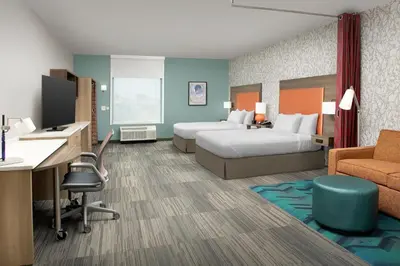 a hotel room with two beds and a desk at Home2 Suites By Hilton Marysville in Marysville