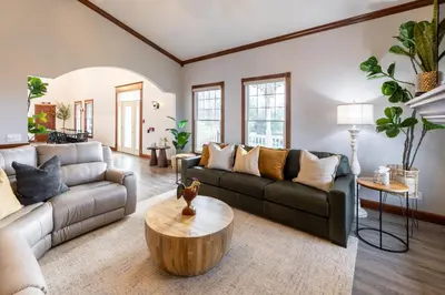 a living room with a couch and a table at Hillside Villa Ohio in Millersburg
