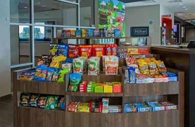 a store display of chips and other snack foods at Tru By Hilton Grove City Columbus in Grove City