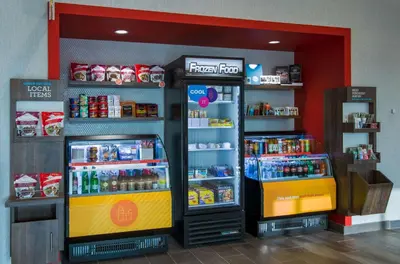 a store with two soda machines in a store at Tru By Hilton Grove City Columbus in Grove City