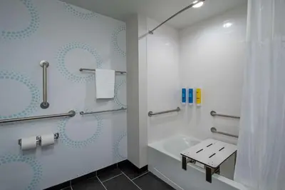 a bathroom with a tub and a shower with a shower curtain at Home2 Suites By Hilton Grove City Columbus in Grove City