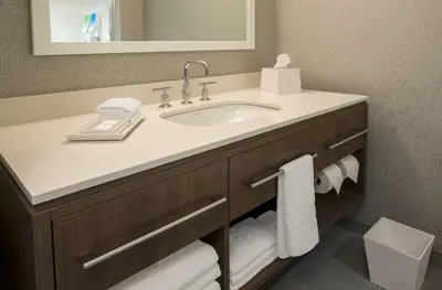 a bathroom with a sink and a mirror at Home2 Suites By Hilton Grove City Columbus in Grove City