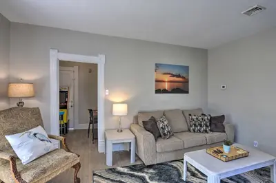 a living room with a couch and a table at Port Clinton Getaway - Walk to Beach and Restaurants in Port Clinton
