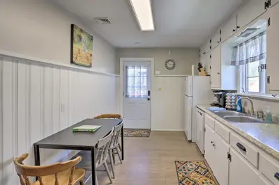 a kitchen with a table and a dining room at Port Clinton Getaway - Walk to Beach and Restaurants in Port Clinton