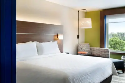 a hotel room with a bed and a window at Holiday Inn Express & Suites Heath - Newark by IHG in Heath