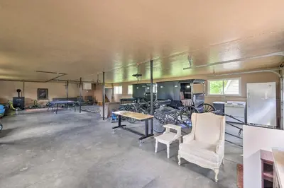 a large room with tables and chairs in it at Loft Unplugged with Outdoor Space in Amish Country! in Burton