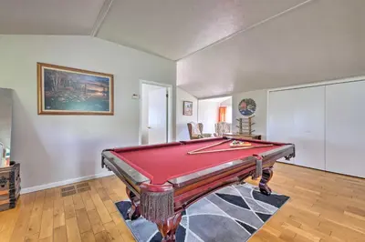 a living room with a pool table in it at Loft Unplugged with Outdoor Space in Amish Country! in Burton