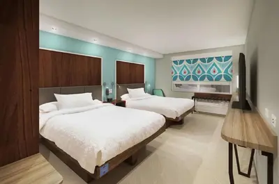 a hotel room with two beds and a television at Tru by Hilton Perrysburg Toledo in Rossford