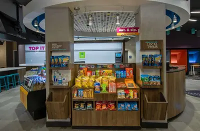 a store with a display of food and drinks at Tru By Hilton Columbus Airport in Columbus