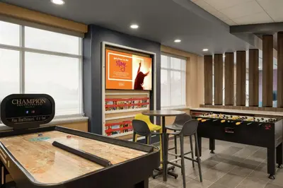 a game room with a table and ping pong tables at Tru By Hilton Sandusky, Oh in Sandusky