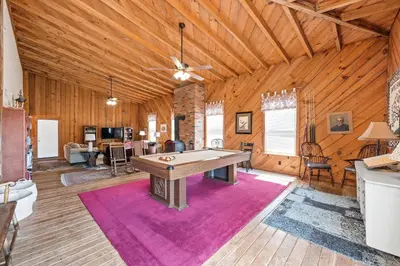 a large room with a pool table in it at Country Lodge for 18, With Pool and Pond, Near Ark in Williamstown