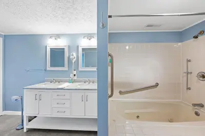 a bathroom with a tub and a sink at Country Lodge for 18, With Pool and Pond, Near Ark in Williamstown