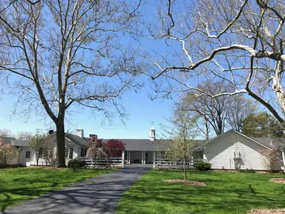 a house with a driveway in front of it at Millsite Lodge in Sandusky