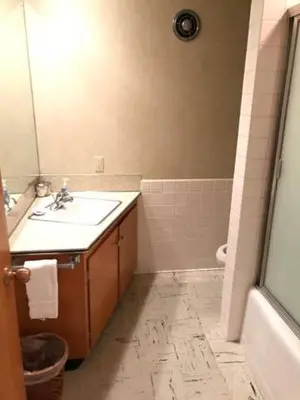 a bathroom with a sink and a bath tub at Millsite Lodge in Sandusky