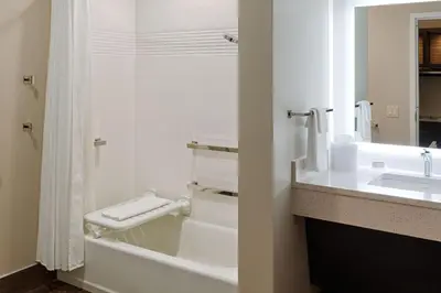 a white bathroom with a sink and a toilet at TownePlace Suites Columbus Hilliard in Hilliard