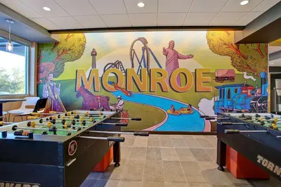 a room with a large mural of the marride at Tru By Hilton Monroe, Oh in Monroe