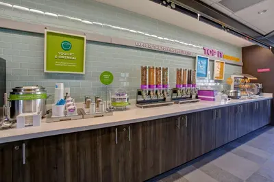 a store counter with a bunch of products on it at Tru By Hilton Monroe, Oh in Monroe