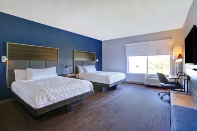 a hotel room with two beds and a window at Tru By Hilton Monroe, Oh in Monroe