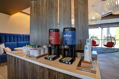 a hotel room with two coffee machines on a counter at Tru By Hilton Monroe, Oh in Monroe