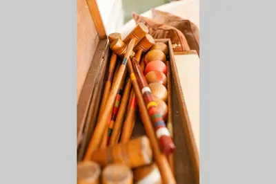 a bunch of wooden baseball bats lined up against a wall at Homestead at Millsite Lodge in Sandusky