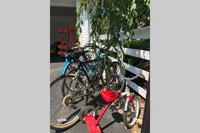 two bikes are parked next to a fence at Homestead at Millsite Lodge in Sandusky