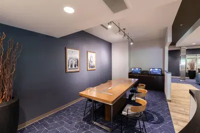 a meeting room with a wooden table and chairs at Courtyard by Marriott Cincinnati Midtown/Rookwood in Cincinnati