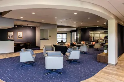 a lobby with chairs and a waiting room at Courtyard by Marriott Cincinnati Midtown/Rookwood in Cincinnati