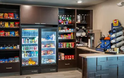 a kitchen with an open refrigerator filled with food at My Place Hotel-Marion, OH in Marion