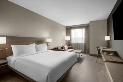 a large white bed in a hotel room at AC Hotel by Marriott Pittsburgh Southpointe in Canonsburg