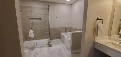 a bathroom with a shower and a toilet and a sink at Inn at Amish Door in Wilmot