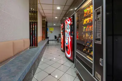 a hallway with two vending machines in a restaurant at Days Inn by Wyndham Sandusky Cedar Point in Sandusky