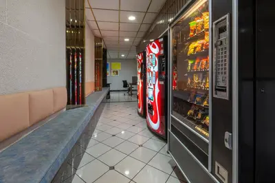 a hallway with two vending machines in a restaurant at Days Inn by Wyndham Sandusky Cedar Point in Sandusky