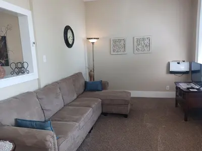 a living room with a couch and a table at Lee House Inn in Maysville